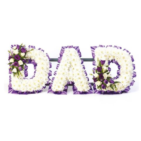 A mass of white double spray chrysanthemums is finished with delicate sprays of roses and lisianthus in white and purple to create this Dad tribute.